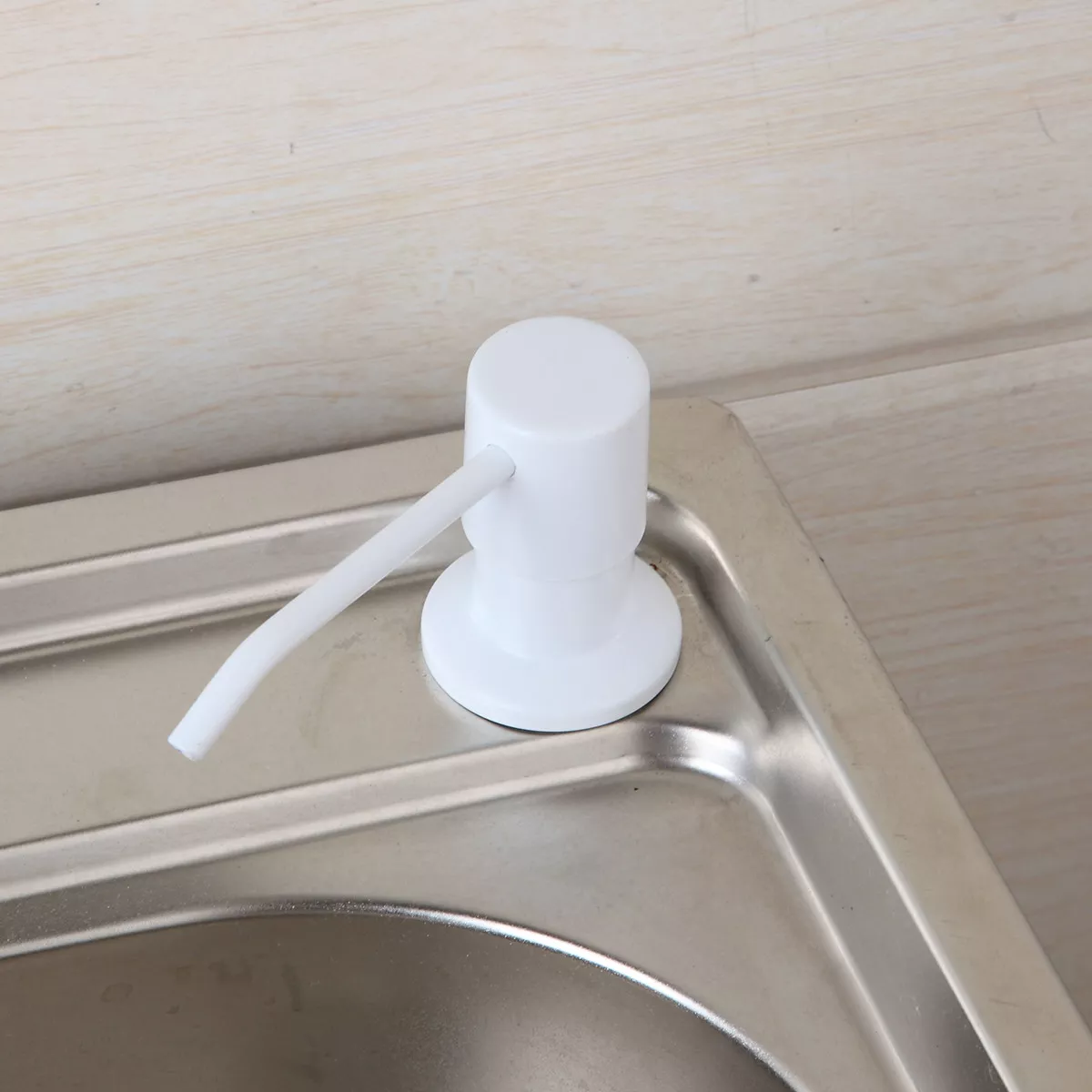 Kitchen sink liquid soap dispenser outlet