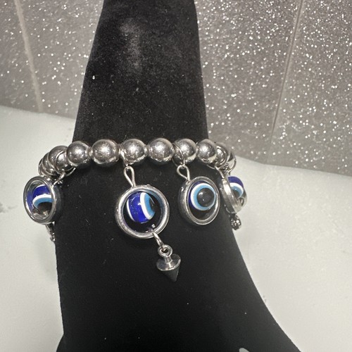 PULSERA ELÁSTICA MAL OJO AZUL PLATEADO CON DIJES - Imagen 4 de 7