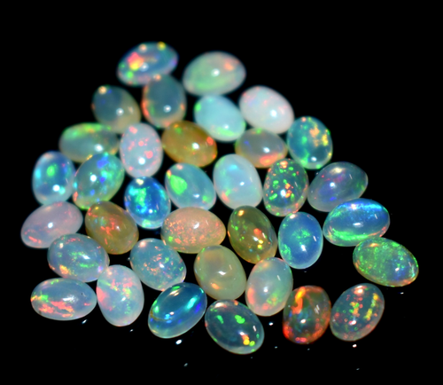 Lote de 35 piedras preciosas de ópalo etíope blanco natural forma ovalada 10,5 quilates 6x4 - Imagen 1 de 5