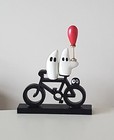 Art-Boo-Boo on a bike with a red balloon - Whimsical figurines on a wood bicycle