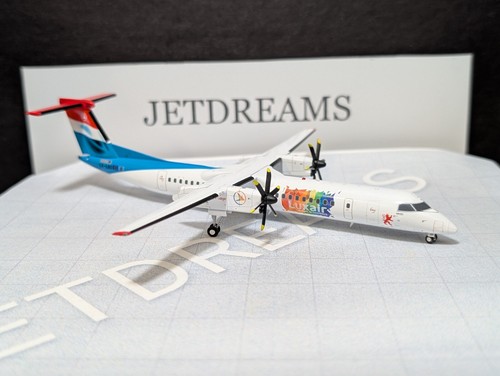1/200 LUXAIR BOMBARDIER Q400-8 / DASH-8 BE PRIDE COLORS LX-LQC JC WINGS - Picture 4 of 9