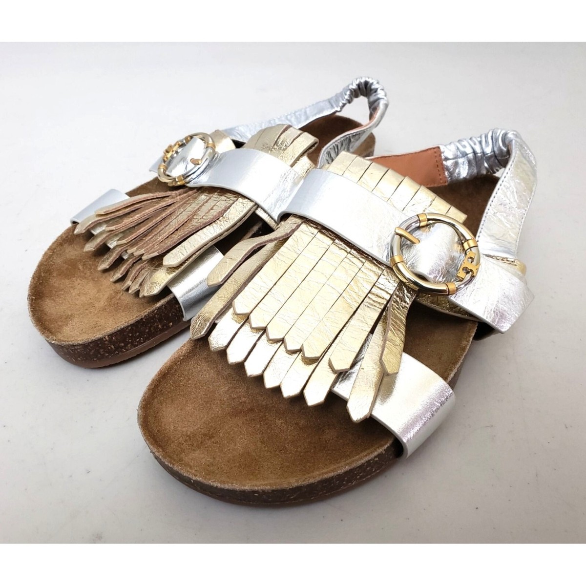 TORY BURCH フリツミティスカト 169354 417 Tory Burch Multi Logo Kiltie Sandals in Metallic Silver Gold