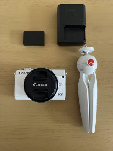 Canon EOS M100 with tripod, mirrorless single lens white