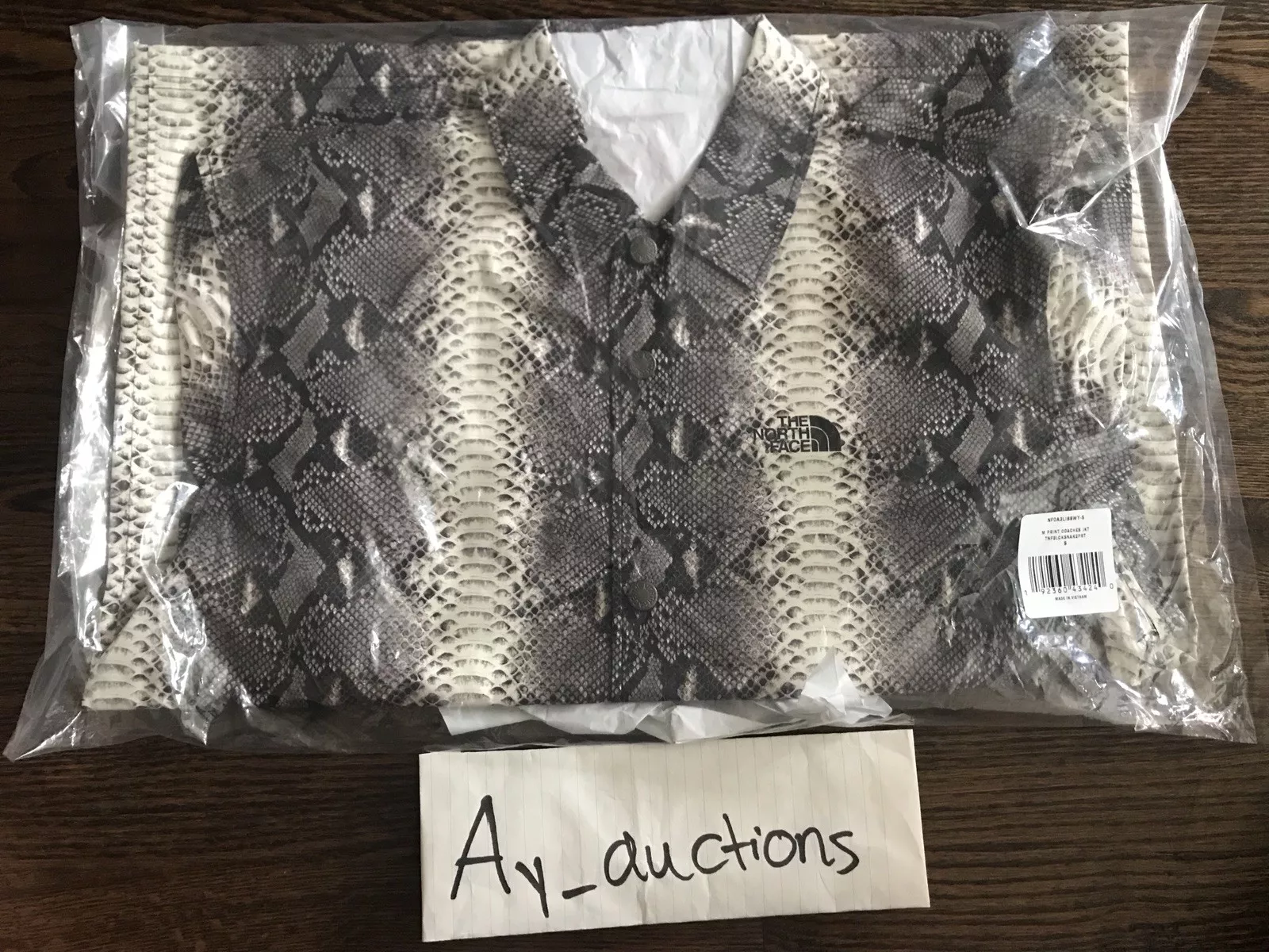 Veste d'entraîneur Supreme The North Face peau de serpent couture collée noir gris petit ss18