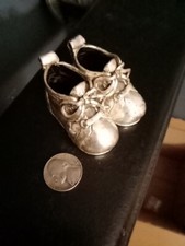 Silver miniature baby shoes