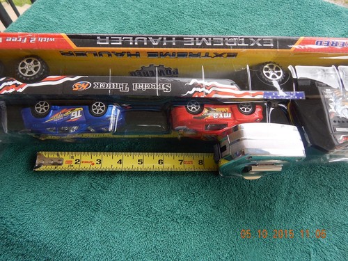 TOY SEMI TRUCK, EXTREME HAULER,FRICTION POWER, FLATBED,WITH 2 RACE CARS - Picture 9 of 11