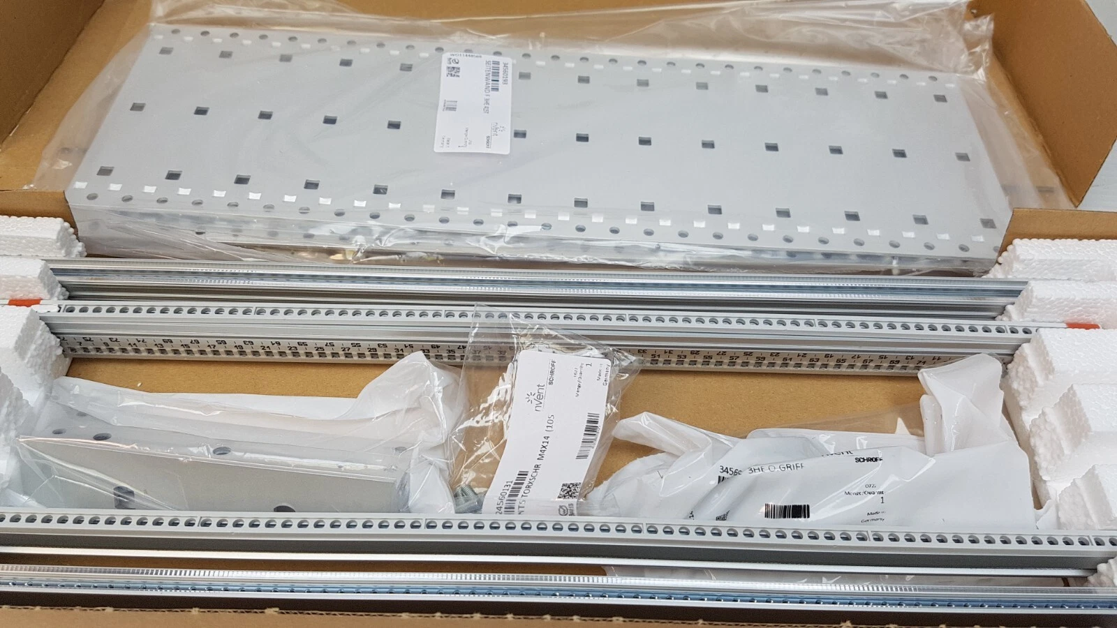 EuropacPRO kit contents in foam: side panels, horizontal rails and parts bags
