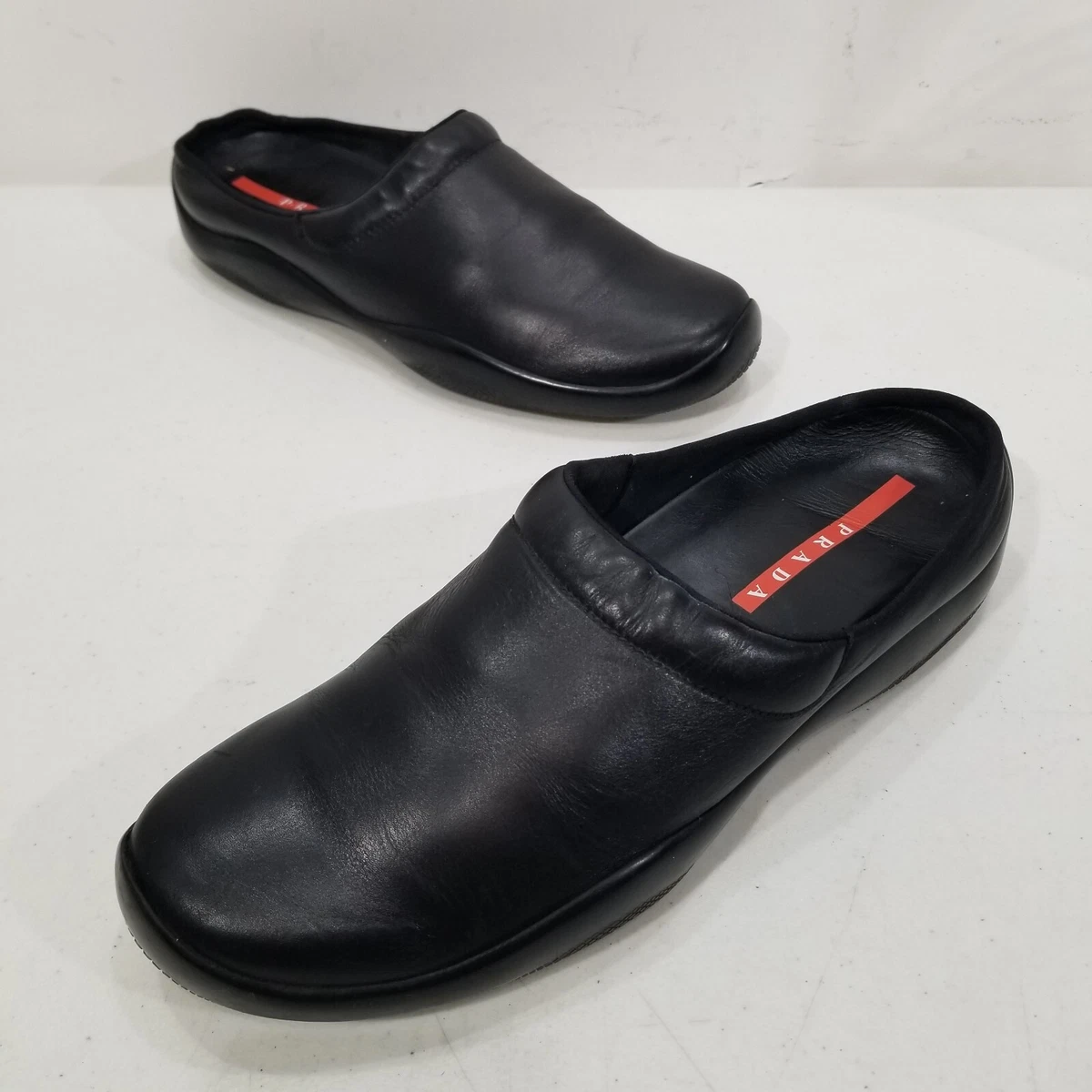 Easy Slip-Ons: Men's Prada Black Leather Slip-On Mules