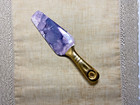 Contemporary cake server with purple marble blade and gold handle
