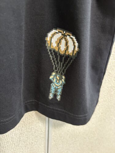 CAMISETA UNIQLO METAL GEAR ARCHIVO SÓLIDO GRÁFICO UT en Mano Negra Bsp - Imagen 6 de 10