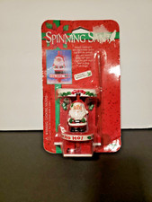 SPINNING SANTA Christmas toy SPINS INTO THE HOLIDAY SPIRIT sealed PACKAGE