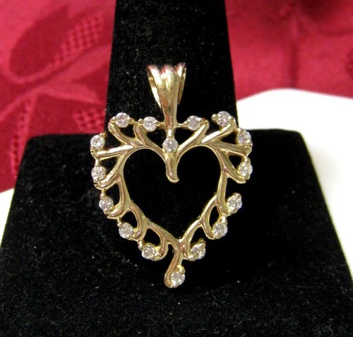 COLGANTE AMOR CORAZÓN DIAMANTE 0,48 CTW ORO AMARILLO 14K 5,4 GRAMOS - Imagen 1 de 6