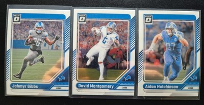 Detroit Lions 3er-Lot - Donruss Optic 2024 NFL (Gibbs, Montgomery & Hutchinson)