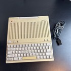 Komputer i zasilacz Apple IIc A2S4000, działający