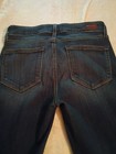 Back view of Paige Jeans Laurel Canyon 27 low rise boot cut medium wash with two pockets and brown leather patch on waistband.