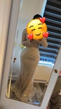 Elegant, high-neck evening dress with beading and a flowing, floor-length design