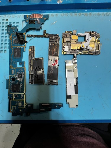 Lot of 13 iPhone, samsung motherboards FOR PARTS