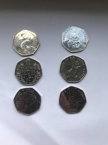 full set of beatrix potter 50p coins and new peter rabbit 50p