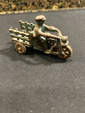Antique arcade cast iron Farmall tractor with farmer has wooden wheels 5.5 in
