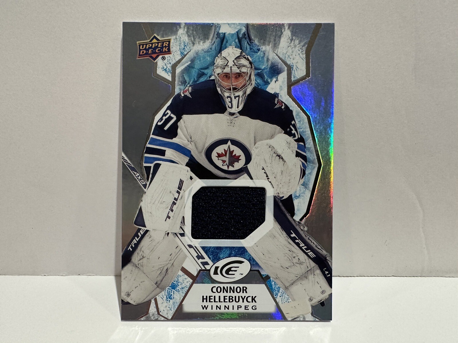 2021-22 UD Ice Jersey Relic #53 Connor Hellebuyck Winnipeg Jets Hockey Card NHL!