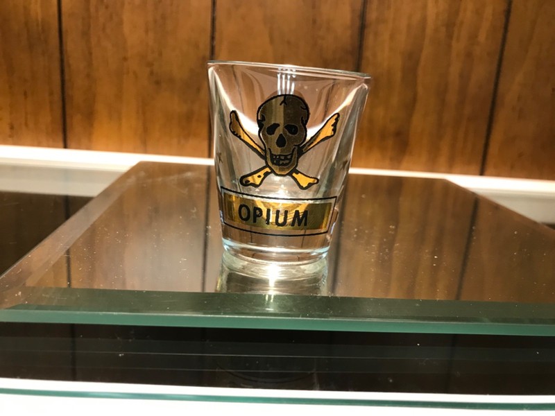 opium gold skull shot glass black trim gold stars