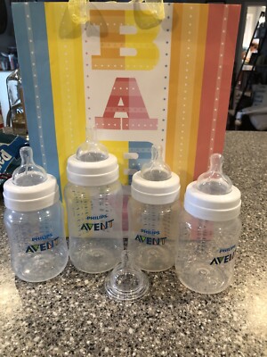 Avent Bottle Lot. (3) 9 Oz Bottles & (1) 11 Oz Bottle. (5) New Nipples . (1) Cap