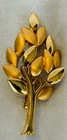 Vintage Orena Paris tree brooch featuring combination of matte shiny gold leaves