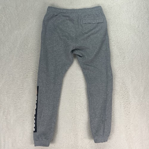 Petit pantalon de survêtement conique gris homme Nike Sportswear polaire Just Do It - Photo 5/7