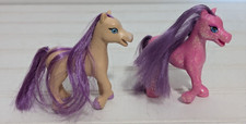 2 Ponies/Horses 3 in" tall 1 Tan  1 Pink Sparkle both Purple Manes  Tails