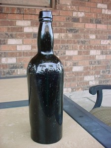 Unusual-Base-Embossed-Black-Glass-Patent-Bottle