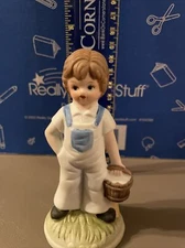 Figurine Ceramic boy in overalls with bucket