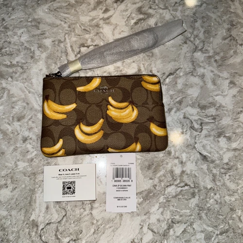 Bracciale COACH con zip angolare in tela firmato con stampa banana CR820 nuovo con etichette