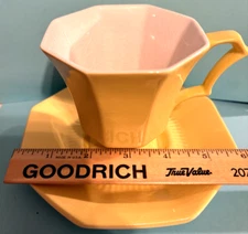 Daffodil by Ironstone Yellow with white bottom footed cup and saucer set