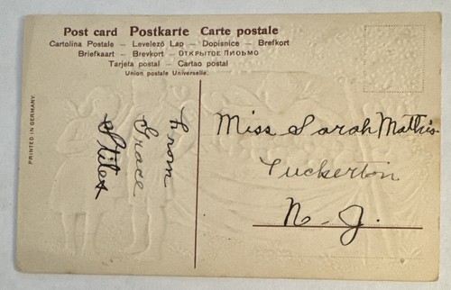 Embossed Valentines Day Postcard Cupid Cherub Selling Hearts To Couple Germany - Picture 2 of 2