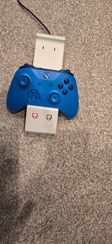 Microsoft Wireless Controller for Xbox One  Blue with charging dock.