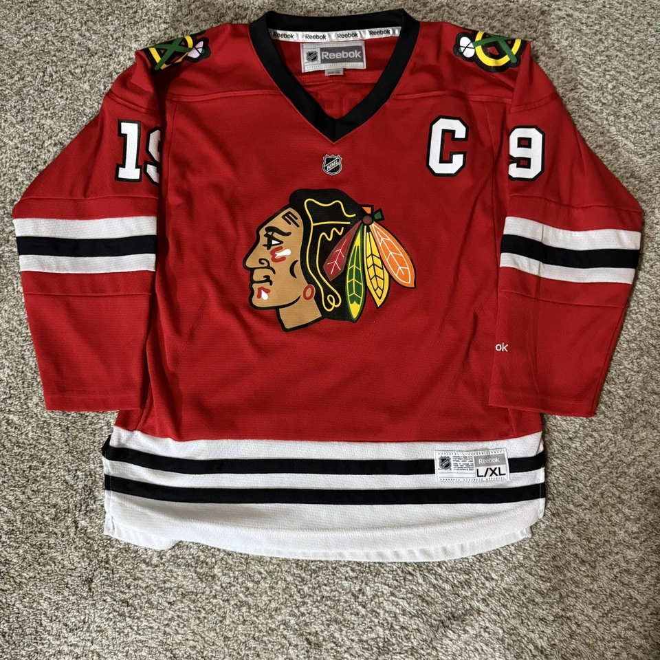 Camiseta deportiva de los Chicago Blackhawks juvenil grande XL NHL hockey Jonathan Toews 19 Reebok Foto 2 de 4