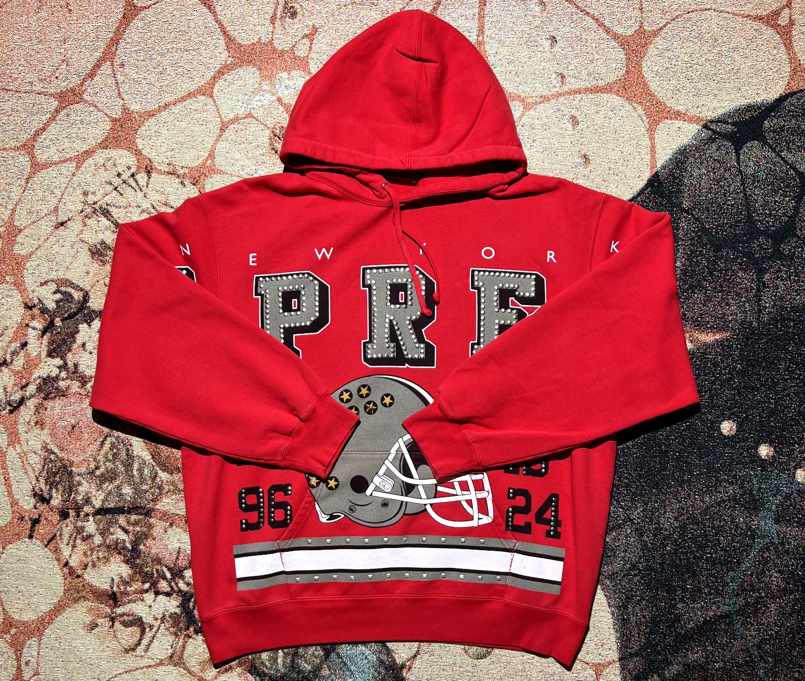 Sweat à capuche clouté Supreme Champions rouge taille extra large neuf