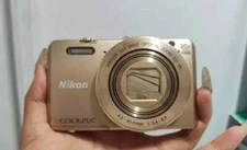 Nikon Coolpix S7000  16MP 20x Zoom Digital Camera English Language Gold