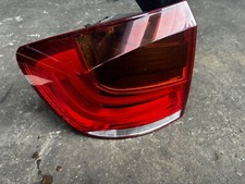 2010 BMW X1 SERIES E84 NS LEFT PASSENGER REAR TAIL LIGHT P/N 2992477