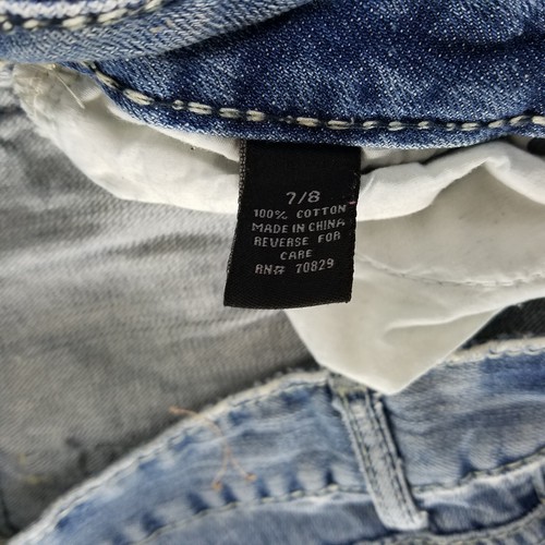 Jeans Rue21 Juniors 7 tiro bajo recortado bootcut desgastado lavado medio azul denim - Imagen 9 de 14