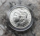 1900-O MORGAN SILVER DOLLAR IN BU CONDITION.