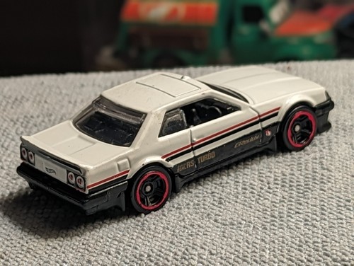 CAPTIVATING 1982 NISSAN SKYLINE R30 PERFECT COLOR SCHEME MFG 2017 1:64 SCALE MB - Bild 13 von 24