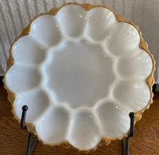 White milk glass deviled egg tray with gold trim