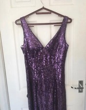 Sparkly brand new with tags, purple dress size 12 with black bow