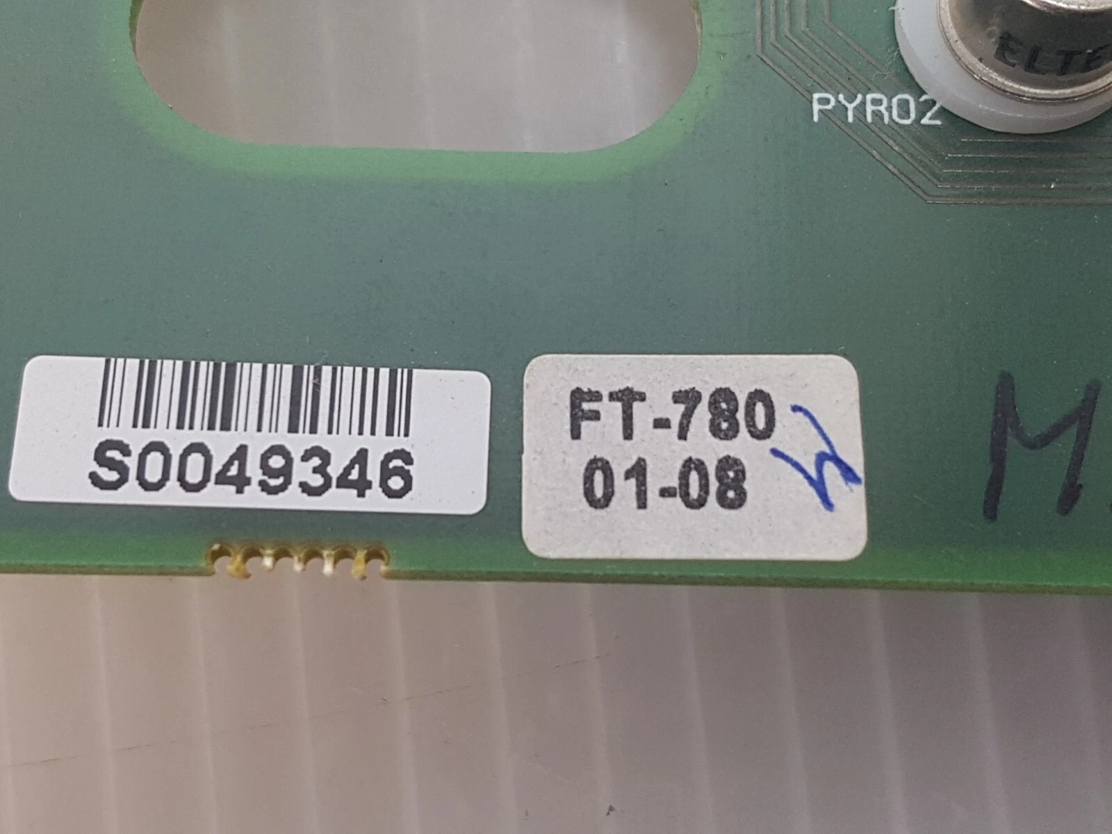 Factory barcode sticker and FT-780 01-08 label on the 0633-474-01 Rev. B board