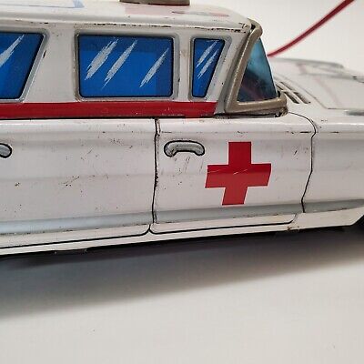 Vintage Tin Yonezawa Cadillac Red Cross Ambulance With Vintage Tin Yonezawa Cadillac Red Cross Ambulance With