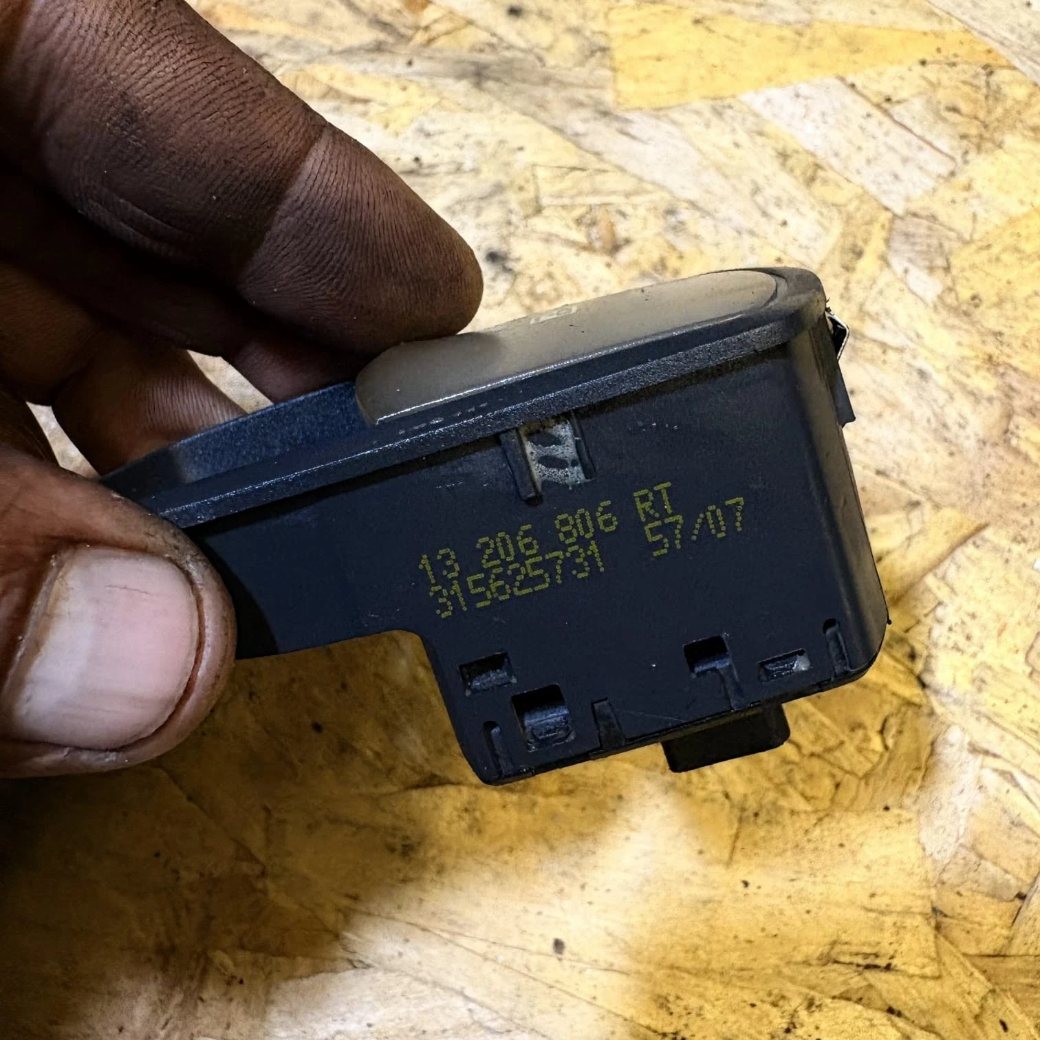 Vauxhall Corsa D window switch rear showing 13206806 RT part number