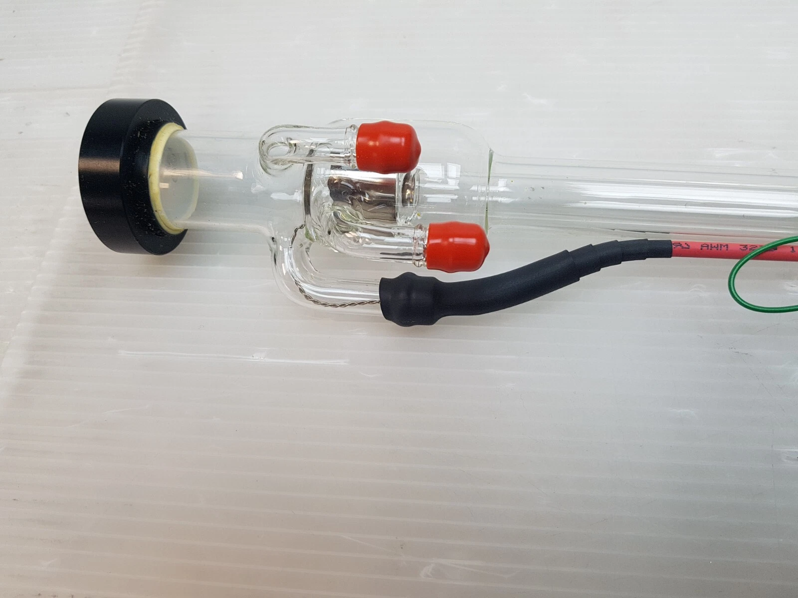End of the Sharplan laser tube: black end mount and glass side arms with red caps