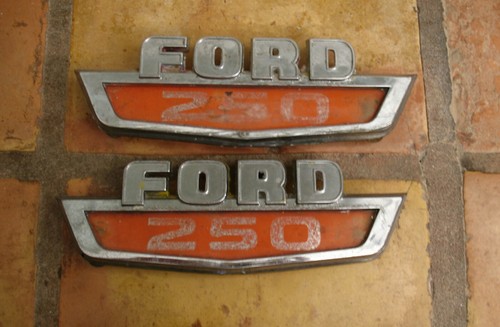 B24 - VINTAGE FORD 250 1960's EMBLEM PAIR WITH RED PLASTIC INSERTS C4TB-16A652 - Picture 1 of 2