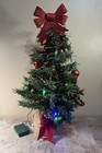 2ft mini tree with red bow on burlap stand with garland and christmas ornaments